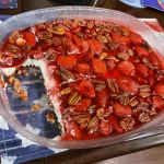 This legendary 3-layer dessert salad combines buttery pretzel crust, creamy cheesecake filling, and fresh strawberry Jell-O topping for the perfect sweet-salty crunch. Always the first to disappear at potlucks!